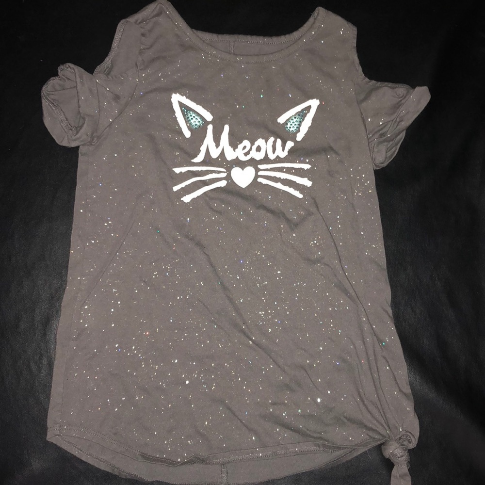 A short sleeve shirt. From justice.